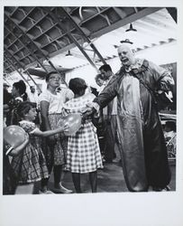 Timbo the clown hands out Balloons the Sonoma County Fair, Santa Rosa, California, 1957