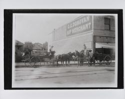 Pearse Express wagons in front of C.C. Donovan Hop Merchant