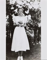 Mary McGregor holding a bouquet of flowers, Santa Rosa, California, about 1936