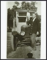 Charles McCord with his dog and delivery truck