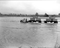 Truck driving on a flooded road