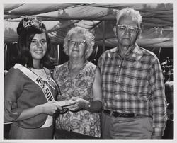 Miss Sonoma with senior couple at the Sonoma County Fair, Santa Rosa, California, 1966
