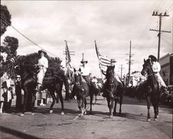 Color guard of the California Centaurs mounted junior drill team in the 1946 Rose Parade, Santa Rosa, California