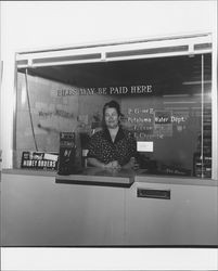 Window at Roger Wilco Market where utility bills may be paid, Petaluma, California, 1956