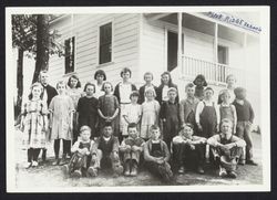 Students posing in front of Pine Ridge School