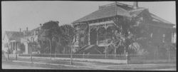 One-and-a-half story Queen Anne Victorian house on the corner of an unidentified street in Santa Rosa, California, 1890s or early 1900s