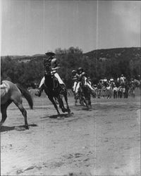 Three members of the California Centaurs mounted junior drill team riding in a line at the Boyes Hot Springs Horse Show in 1946