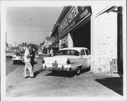 Car in driveway of Conti and Graham Household Appliances, Petaluma, California, 1958