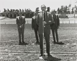 Members of the Sonoma County Fair Board standing on the race track, Santa Rosa, California, July, 1972