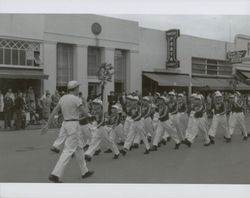 Boys drill team marches in a parade, 400 block of Fourth Street, Santa Rosa, California, between 1950 and 1955
