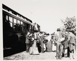 McNear family members and friends stand by a Petaluma and Santa Rosa Railway Company train stopped at the Forestville Station, California, about 1910