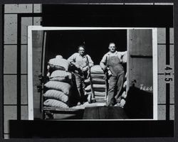 Railroad workers unloading feed at Kenwood