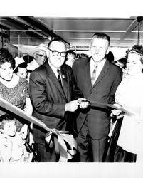 Edmund G. Brown and George McCabe cutting a ribbon