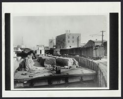 Barge and a train at McNear Co. docks