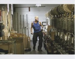 Harold Allen holding a bobbin, Sunset Line & Twine, Petaluma, California, Dec. 2006