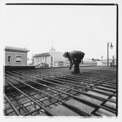 Construction worker clipping forms for the roof of the new Exchange Bank building, 545 Fourth Street, Santa Rosa, California, 1971