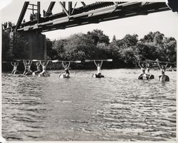 Barrel racers under the Healdsburg Bridge, Healdsburg, California, 1946