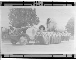 Float with women and girls inside large eggs in a Petaluma Butter and Eggs Days Parade, California, 1923