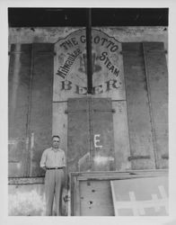 Portrait of Ed Fratini beside the old Milwaukee Steam Beer sign, Petaluma, California, Spring, 1959