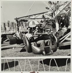 Mothers and daughters take a ride at the Sonoma County Fair carnival, Santa Rosa, California