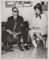 Georgia Gallagher with an unidentified blind man and guide dog