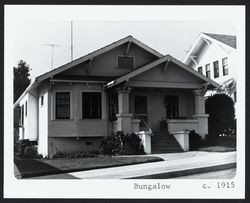 Small California Stucco Bungalow with roof brackets