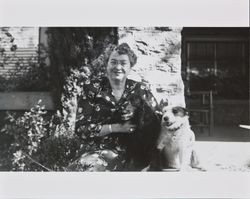 Dagny Juell posing for a photograph with her dogs, Santa Rosa, California, about 1953