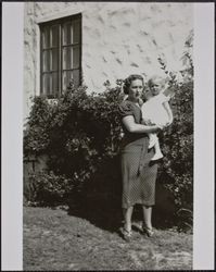 Woman holding baby Joan Spolini, 200 Dana Street, Petaluma, California, April 26, 1938