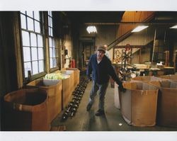 Tim Rhodes and Russell Strickland in the Coating/Oil room at Sunset Line & Twine Company in Petaluma, California, Dec. 2006