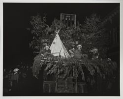 Children dressed as Indians on a float in an unidentified parade