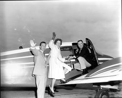 Don Clausen and Mr. and Mrs. Fred Dupuis getting into an airplane, Santa Rosa, California, 1960