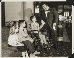 Sport figures with crippled children who participated in the charitable events of the Red Coat Organization, Santa Rosa, California, 1960