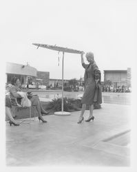 Long coat modeled in the Dramatic Moods of Autumn fashion show, Santa Rosa, California, 1959