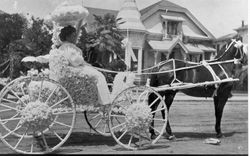 Lois Forsyth and Nan Gould driving horse and carriage in the Rose Parade