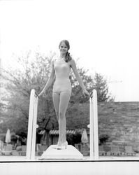 Rhonda Severy, 1971 Miss Sonoma County, standing on a diving board, Santa Rosa, California, 1971