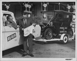 Harper family car being towed during the reenactment of the Phoenix, Ariz. to Eureka, California trip in 1961