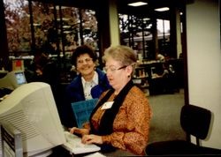 Norma Kennemer and Carmelita Combs at a Library computer