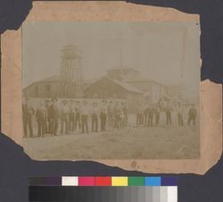 Men standing in front of water tower at the Isaac DeTurk Winery in Santa Rosa, California in the 1890's