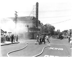 Extinguishing the fire at the California Theatre, Petaluma, California, 1957