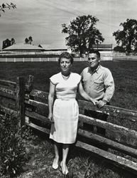 Mary and Jack Dei posing in front of their dairy ranch located at 831 High School Road, Sebastopol, California, 1963