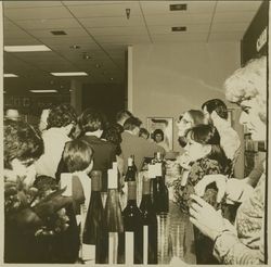 Sears staff, wine bottles and glasses at the wine tasting at Sears opening day celebration, Santa Rosa, California, 1980