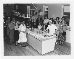 Angelo De Mattia with a large group at his Vienna Bakery, Petaluma, California, 1955