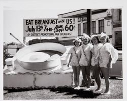 Slick Chicks gathered around a frying pan and egg to promote the 4th District Agricultural Fair breakfast on July 13, 1947 in Petaluma, California