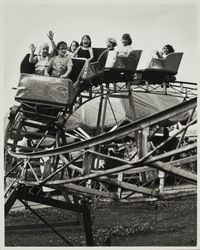 Enjoying the miniature roller coaster at the Sonoma County Fair carnival, Santa Rosa, California