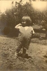 Donald Meacham, age 2-1/2, throwing cherry pit--Uncle Chas. and Aunt Sally's farm near Occidental/Sebastopol