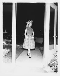 Model with summer blouse, skirt and hat in the Sword of Hope fashion show at the Flamingo Hotel, Santa Rosa, California, 1960