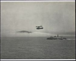Sea biplane and ferry crossing San Francisco Bay, San Francisco Bay, California, 1920s