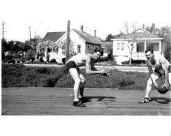 Two unidentified Petaluma Cooperative Creamery basketball team members pose for a picture., Petaluma, California, about 1934