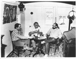 Rod, Louis J. and Louis M. Foppiano sitting around a table sharing a bottle of wine, Healdsburg, California, about 1986