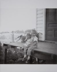 Kay and Sally Evans sit on the porch in Petaluma, California, February 1949